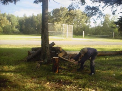 Jamie Ouellette chops wood